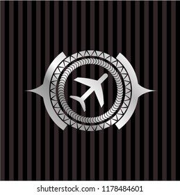 plane icon inside silvery emblem