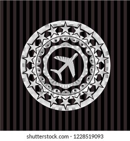 plane icon inside silvery emblem