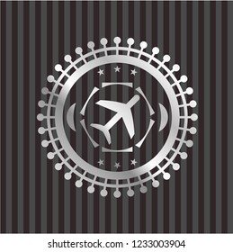 plane icon inside silvery emblem