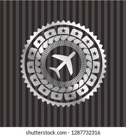 plane icon inside silvery emblem