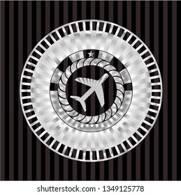 plane icon inside silvery emblem or badge