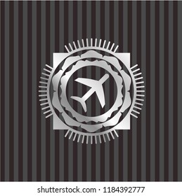 plane icon inside silvery shiny badge