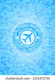 plane icon inside sky blue mosaic emblem