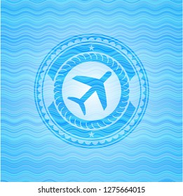 plane icon inside sky blue water wave badge.