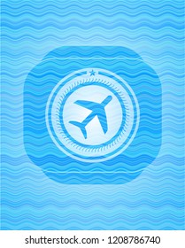 plane icon inside water badge.