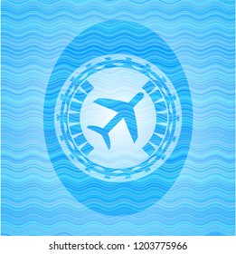 plane icon inside water concept style badge.