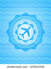 plane icon inside water wave concept badge.