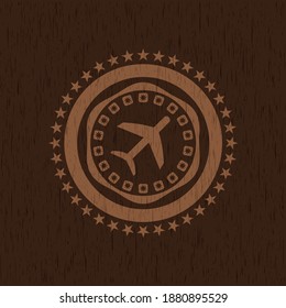 plane icon inside wood badge or emblem. 