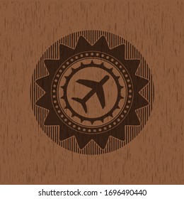 icono del plano dentro del emblema de madera