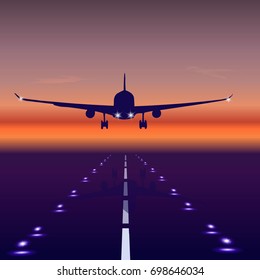 Plane over the runway in the evening