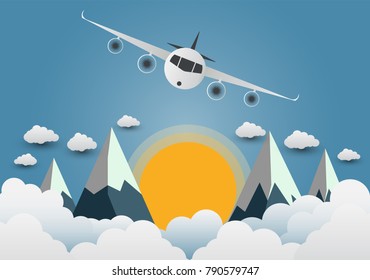 The plane soars over the mountains with beautiful sunsets over the clouds.