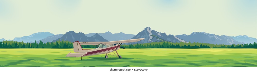 the plane standing on a glade against the background of mountains