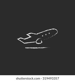 Plane taking off hand drawn in chalk on a blackboard vector white icon isolated on a black background.