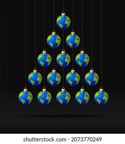 planet earth Christmas and new year greeting card bauble tree. Creative Xmas tree made by world earth on black background for Christmas and New Year celebration. planet greeting card