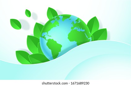 Planet earth on a blue background with green leaves