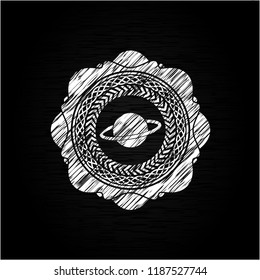planet, saturn icon drawn on blackboard