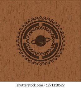 planet, saturn icon inside badge with wood background