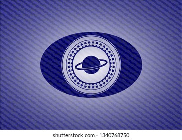 planet, saturn icon inside badge with denim background