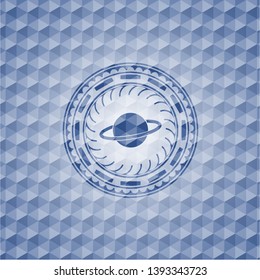 planet, saturn icon inside blue emblem with geometric pattern background.