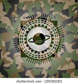 planet, saturn icon inside camouflaged emblem
