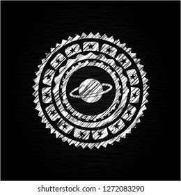 planet, saturn icon inside chalkboard emblem on black board