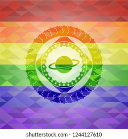 planet, saturn icon inside emblem on mosaic background with the colors of the LGBT flag