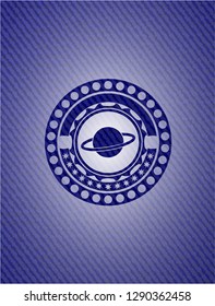 planet, saturn icon inside emblem with denim texture