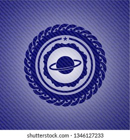 planet, saturn icon inside emblem with denim texture