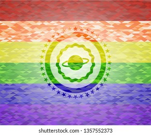 planet, saturn icon inside emblem on mosaic background with the colors of the LGBT flag