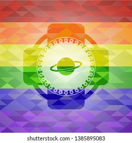 planet, saturn icon inside emblem on mosaic background with the colors of the LGBT flag