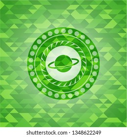 planet, saturn icon inside green emblem with mosaic ecological style background