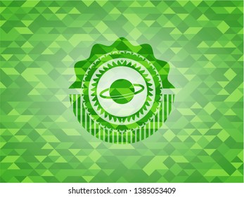 planet, saturn icon inside green emblem. Mosaic background