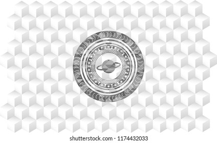 planet, saturn icon inside grey badge with geometric cube white background