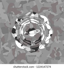 planet, saturn icon inside grey camouflage texture