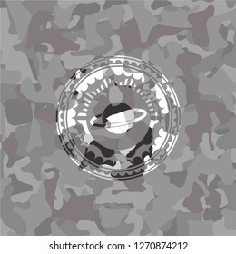planet, saturn icon inside grey camouflage texture