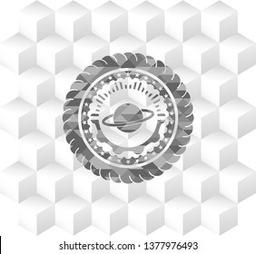 planet, saturn icon inside grey badge with geometric cube white background