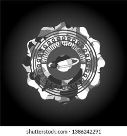 planet, saturn icon inside grey camouflage emblem