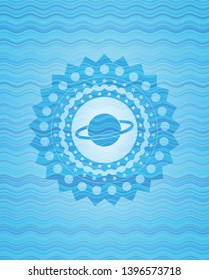 planet, saturn icon inside sky blue water emblem.