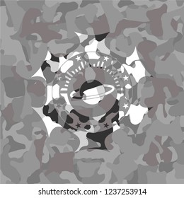 planet, saturn icon on grey camouflage pattern