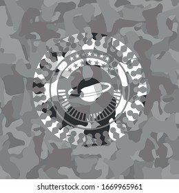 planet, saturn icon on grey camouflage pattern