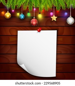 Planked wood with white paper and Christmas ornament 