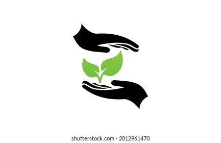 Plant growth between two hands eco symbol