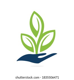 Plant in Hand Vector Logo Design. Natural Products Logo. Cosmetics icon. Spa logo.	