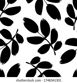 Plant twigs with leaves black paint vector seamless pattern. Hand drawn foliage branch silhouettes isolated on white background. Monochrome botanical design elements with dry brush stroke effect