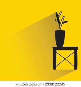 plant vase with shadow on yellow background