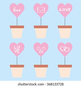 Planted Hearts - Set of flowerpots with hearts in color on a blue background.