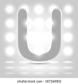 Plastic polished character capital U over enlighted background
