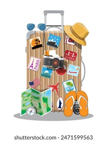 Plastic travel bag. Plastic case with wheels. Hat, photo camera, eyeglasses, paper map, compass, flip flops. Labels places all over the world. Baggage and luggage. Vector illustration in flat style