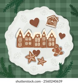 Plate of Christmas cookies. The plate has a lace-like edge, it with gingerbread cookies shaped like houses, stars, hearts, and a gingerbread man.