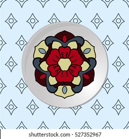 Plate with colored circle ornament on it on the abstract blue background.